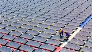 Floating solar panels providing renewable energy. Aerial view floating on solar cells and