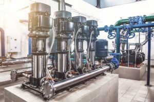 Industry pumps in an technical room.Industrial interior of water pump, valves, pressure gauges